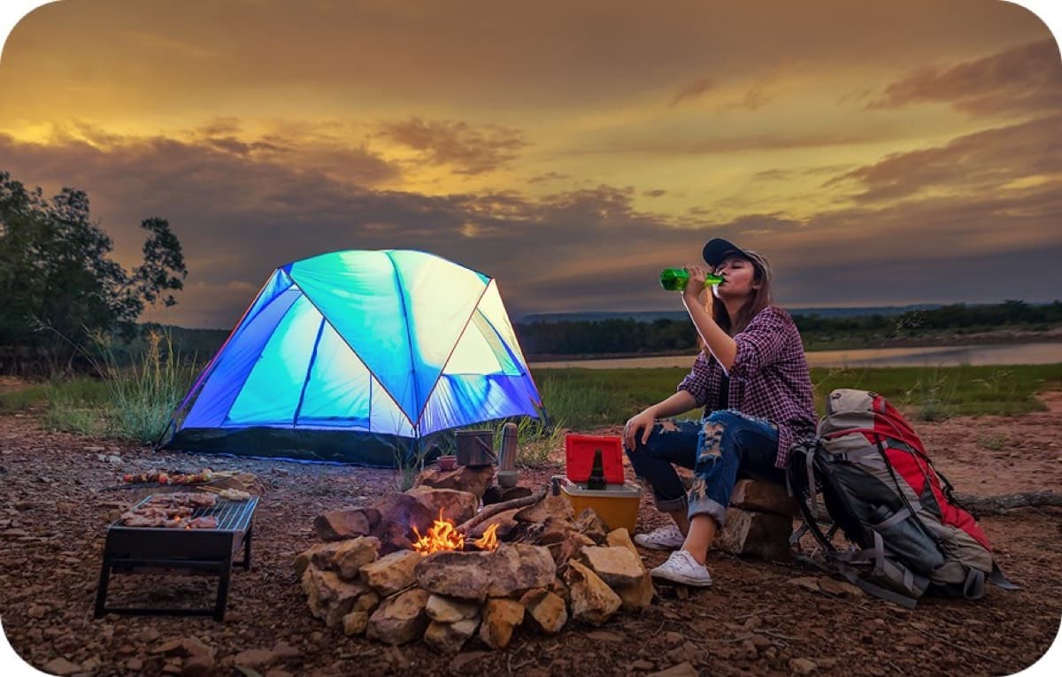 Glamping tent and campfire at dusk